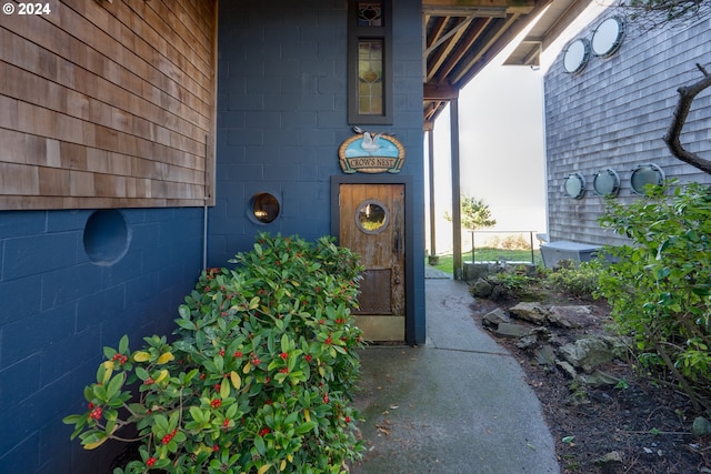 entrance to property with concrete block siding