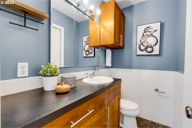 1917 SE 51st Ave, Portland, OR 97215 - bathroom with vanity, a wainscoted wall, toilet, and tile walls