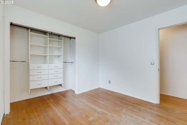 1917 SE 51st Ave, Portland, OR 97215 - unfurnished bedroom with baseboards, light wood-style flooring, and a closet