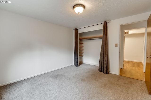 1917 SE 51st Ave, Portland, OR 97215 - unfurnished bedroom featuring carpet floors, a textured ceiling, baseboards, and a closet