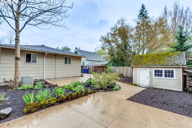 1917 SE 51st Ave, Portland, OR 97215 - exterior space featuring fence, an outbuilding, and central AC unit