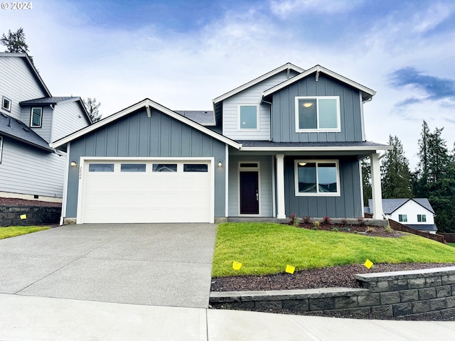 view of front facade with a front yard and a garage