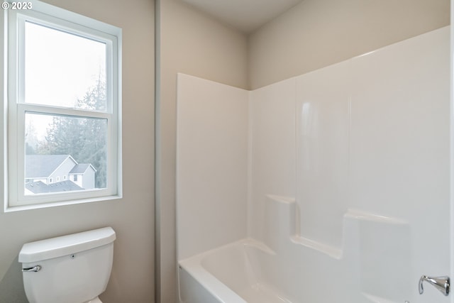 bathroom with toilet and shower / bath combination