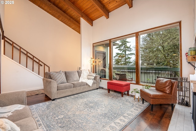 interior space with beam ceiling, hardwood / wood-style flooring, high vaulted ceiling, and wooden ceiling