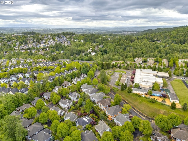 aerial view of residential area with a forest