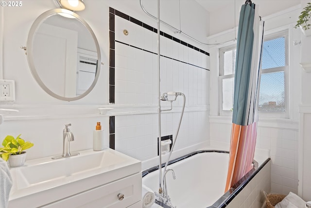 bathroom featuring shower / bath combo and vanity