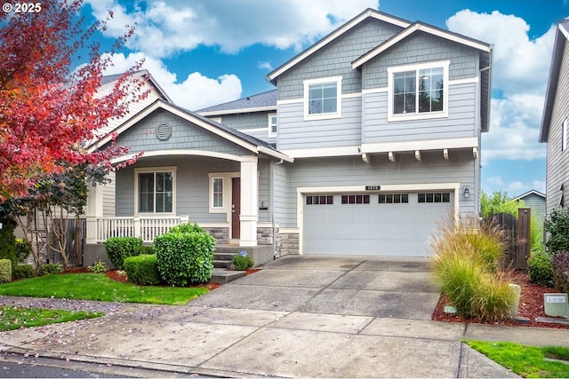 1073 Goff Rd, Forest Grove, OR 97116 - craftsman-style house with covered porch, an attached garage, driveway, and stone siding