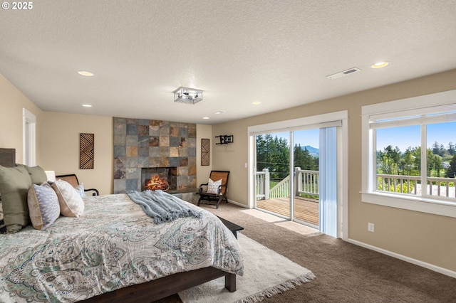 bedroom with access to outside, carpet floors, recessed lighting, baseboards, and visible vents
