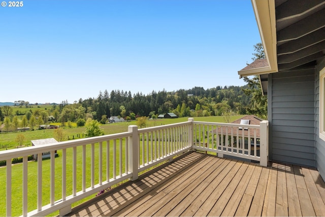wooden deck with a lawn