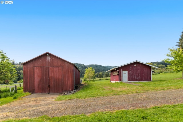 view of barn with a yard