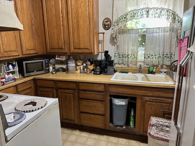 kitchen with sink and white electric stove