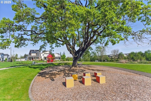 view of property's community with a yard