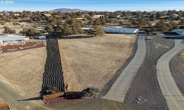 drone / aerial view featuring a mountain view