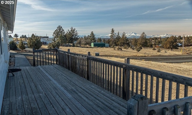 wooden terrace featuring a mountain view