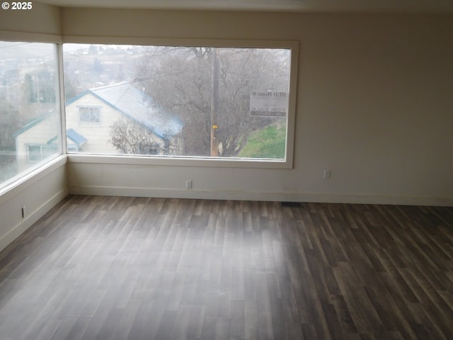 empty room featuring hardwood / wood-style flooring