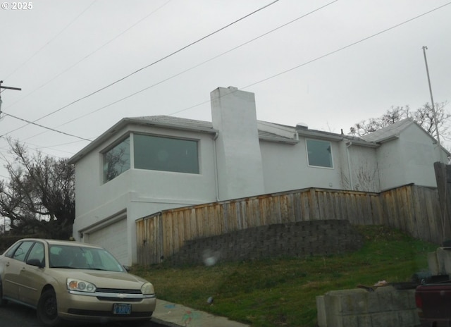 view of property exterior featuring a garage