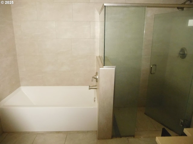 bathroom with tile patterned flooring and independent shower and bath