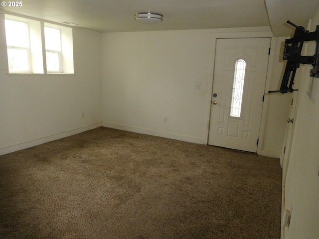 view of carpeted entrance foyer