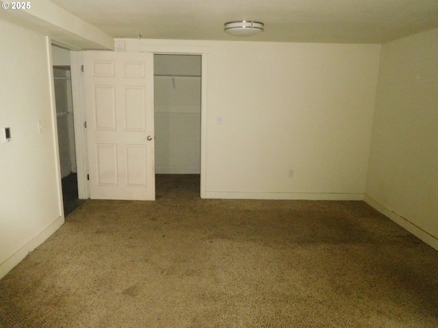 unfurnished bedroom with carpet floors and a closet