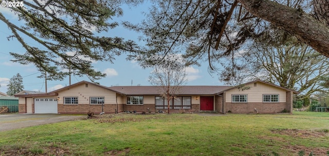 single story home featuring a garage and a front lawn