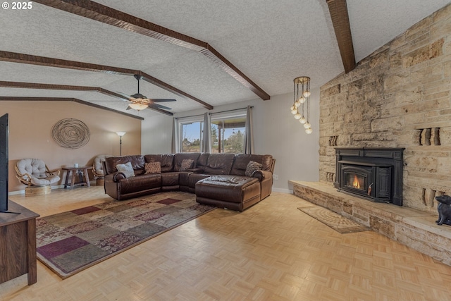 living room with vaulted ceiling with beams, a fireplace, light parquet flooring, and a textured ceiling