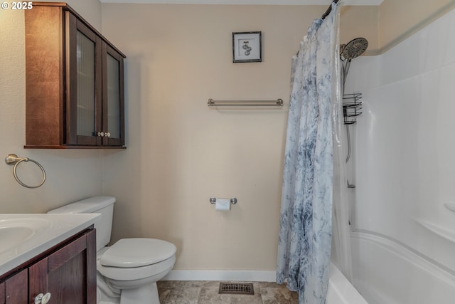 full bathroom with vanity, shower / bath combo, and toilet