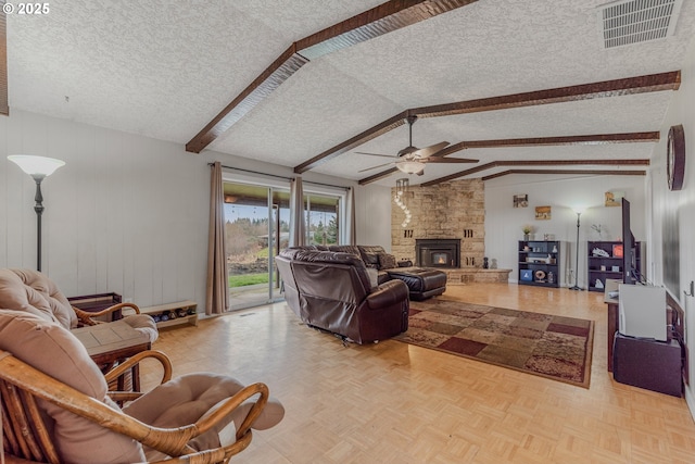 living room with ceiling fan, lofted ceiling with beams, a textured ceiling, and light parquet floors