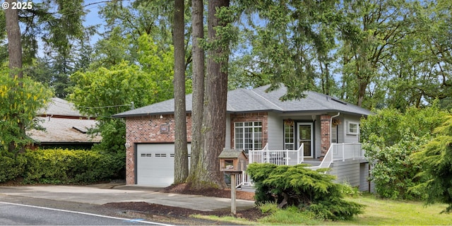 690 N Shepherd Rd, Washougal, WA 98671 - ranch-style home with covered porch, brick siding, concrete driveway, and roof with shingles