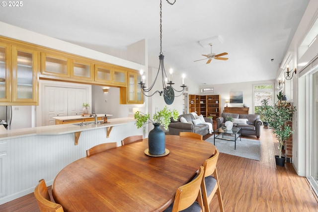 690 N Shepherd Rd, Washougal, WA 98671 - dining room with wood finished floors, ceiling fan, lofted ceiling, and a chandelier
