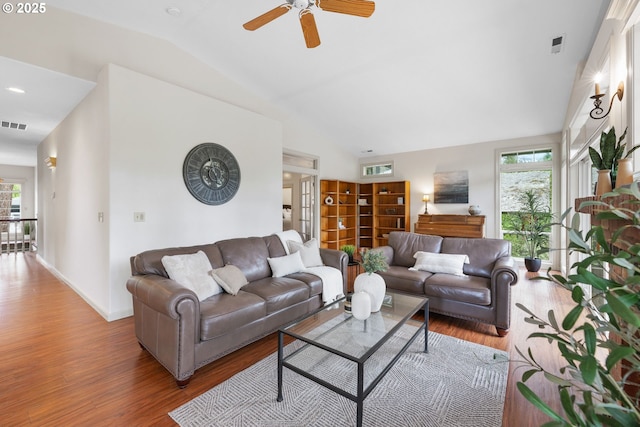 690 N Shepherd Rd, Washougal, WA 98671 - living room featuring vaulted ceiling, wood finished floors, healthy amount of natural light, a ceiling fan, and baseboards