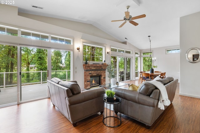690 N Shepherd Rd, Washougal, WA 98671 - living room with lofted ceiling, wood finished floors, a ceiling fan, healthy amount of natural light, and a fireplace