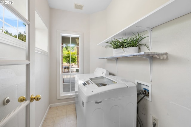 690 N Shepherd Rd, Washougal, WA 98671 - washroom featuring washer and clothes dryer, baseboards, and light tile patterned flooring