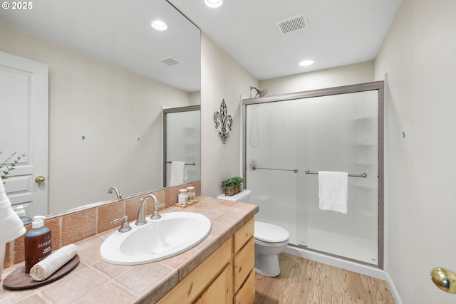 690 N Shepherd Rd, Washougal, WA 98671 - full bath featuring a stall shower, wood finished floors, toilet, vanity, and recessed lighting