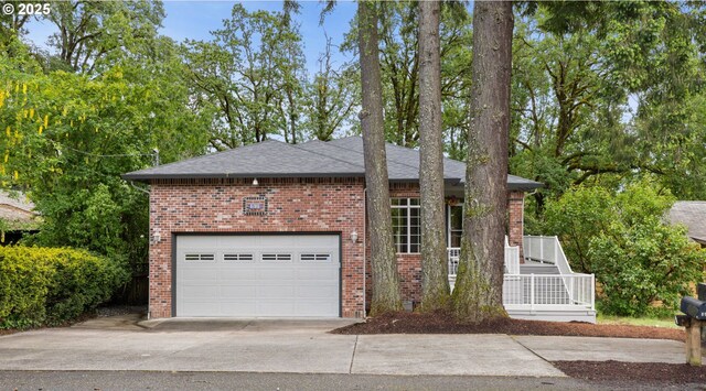 690 N Shepherd Rd, Washougal, WA 98671 - view of front of house with concrete driveway, brick siding, and roof with shingles