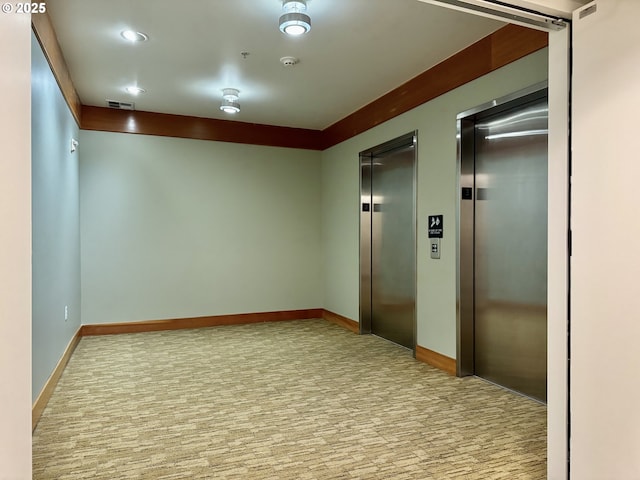 821 NW 11th Ave Unit 315, Portland, OR 97209 - unfurnished room with elevator, carpet floors, recessed lighting, and baseboards