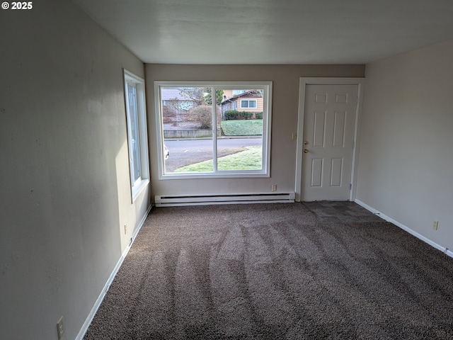 923 S Fir St, Salem, OR 97302 - spare room featuring baseboard heating, carpet flooring, and baseboards
