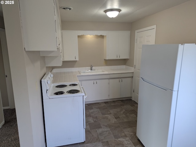 923 S Fir St, Salem, OR 97302 - kitchen with white appliances, a sink, light countertops, and white cabinetry