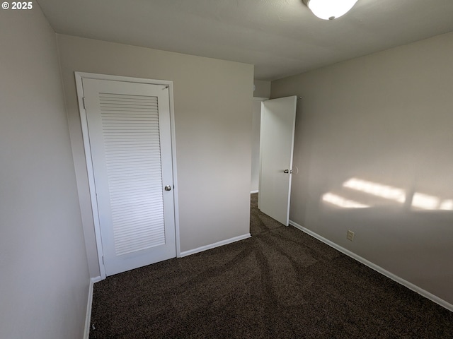 923 S Fir St, Salem, OR 97302 - unfurnished bedroom with dark carpet and baseboards