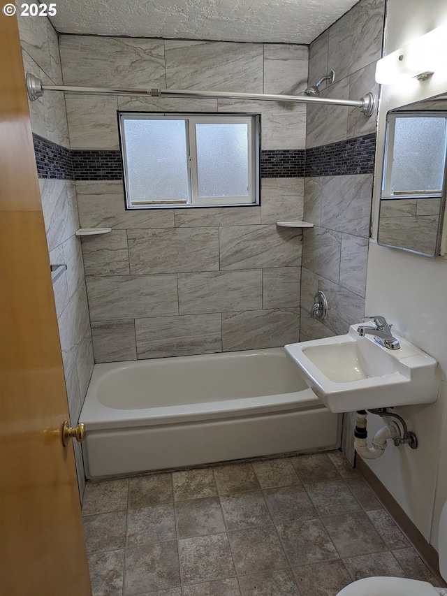 923 S Fir St, Salem, OR 97302 - bathroom with bathtub / shower combination, a sink, and stone finish flooring