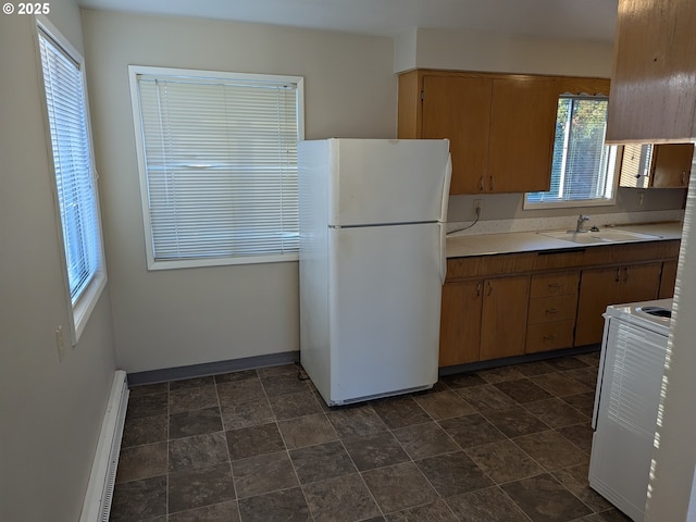 923 S Fir St, Salem, OR 97302 - kitchen with freestanding refrigerator, a sink, stove, and healthy amount of natural light