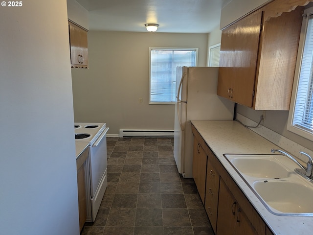 923 S Fir St, Salem, OR 97302 - kitchen featuring white appliances, baseboard heating, a sink, light countertops, and stone finish flooring