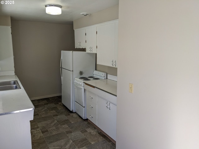 923 S Fir St, Salem, OR 97302 - kitchen with white appliances, white cabinetry, stone finish flooring, light countertops, and a sink