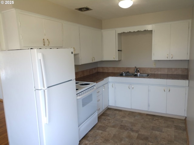 923 S Fir St, Salem, OR 97302 - kitchen featuring white appliances, a sink, white cabinetry, and dark countertops