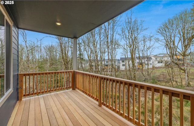 wooden deck with a residential view