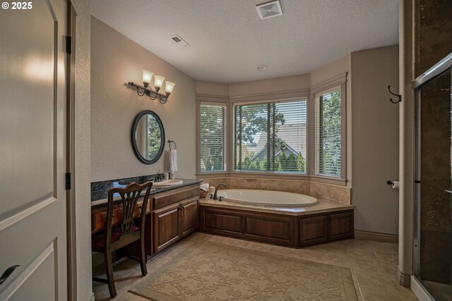 6147 Quail Hollow St, Salem, OR 97306 - full bath featuring a bath, vanity, a textured ceiling, a shower stall, and tile patterned floors