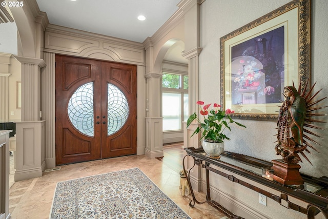 6147 Quail Hollow St, Salem, OR 97306 - foyer entrance with arched walkways, decorative columns, recessed lighting, french doors, and a decorative wall