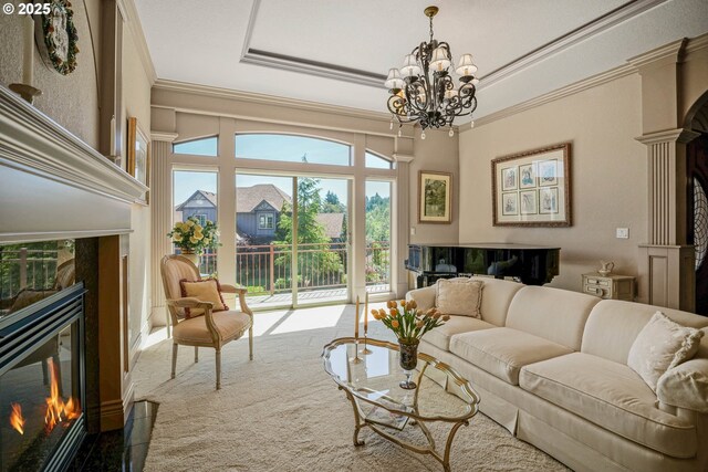 6147 Quail Hollow St, Salem, OR 97306 - living area with a tile fireplace, ornamental molding, and a chandelier