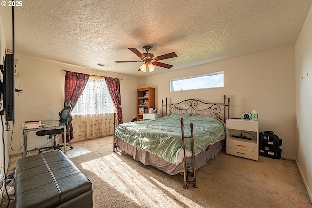 1131 Veronica Ln, Eugene, OR 97404 - carpeted bedroom featuring multiple windows, a textured ceiling, and ceiling fan