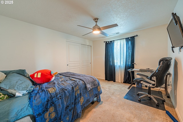 1131 Veronica Ln, Eugene, OR 97404 - carpeted bedroom with a desk, a ceiling fan, a closet, and a textured ceiling