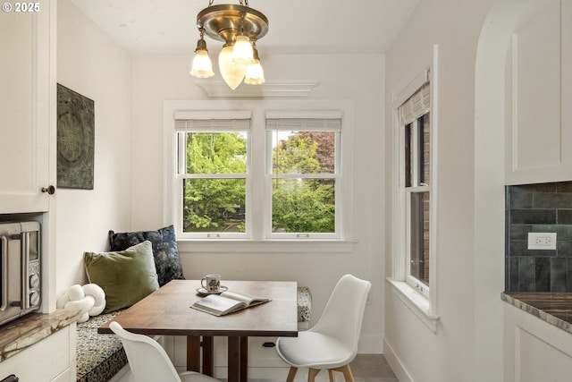 3622 NE Hassalo St, Portland, OR 97232 - dining room featuring a chandelier and baseboards